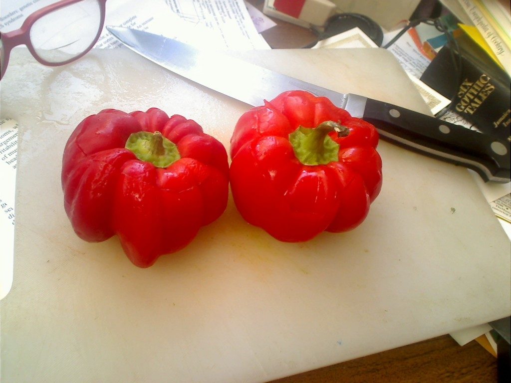 Red Sweet Peppers with Glasses and Chef's Knife