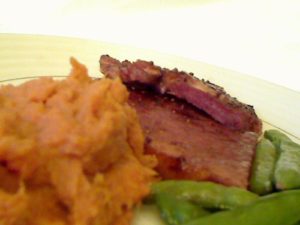 Ham Steak, Mashed Sweet Potatoes and Sweet Peas in the Shells