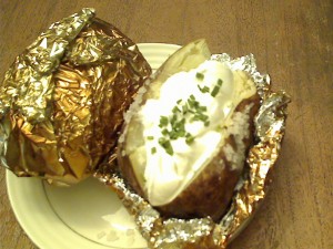 barbecue baked potato with sour cream and chives