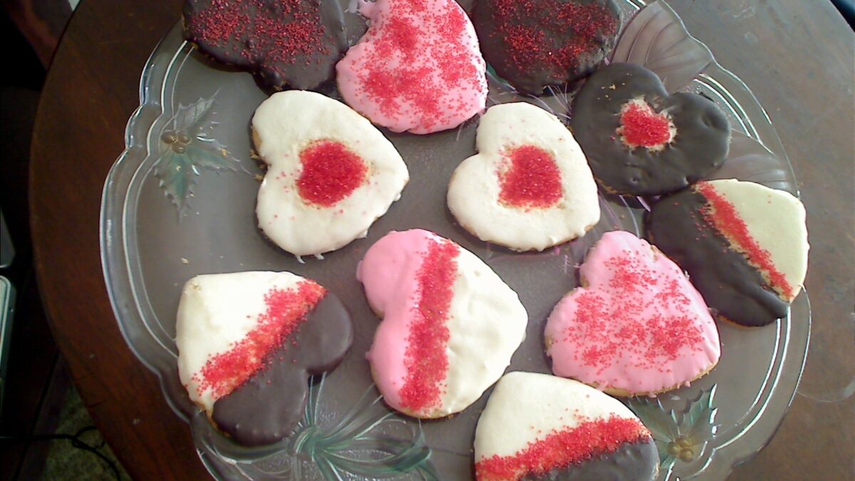 Glazed painted heart powdered sugar cookies with colored sugar
