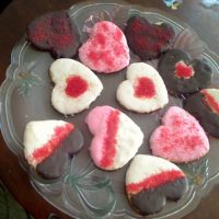 Glazed painted heart powdered sugar cookies with colored sugar