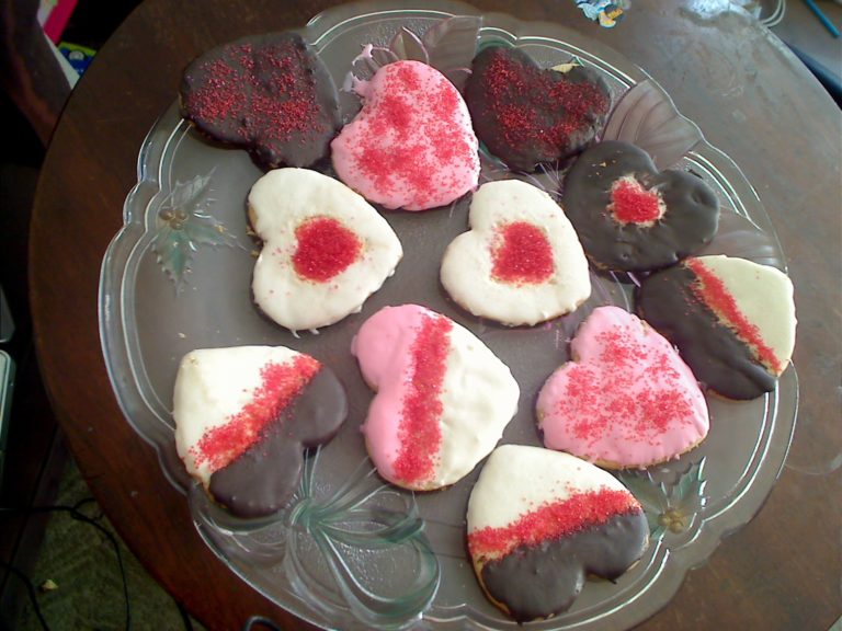 Glazed painted heart powdered sugar cookies with colored sugar