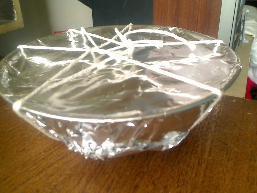 Bowl of Pudding with Foil Tied with String