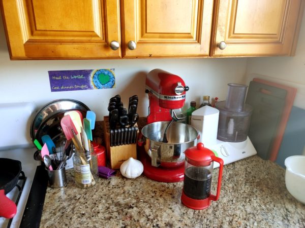 Equipment in my prep area with my KitchenAid mixer and my Braun food processor, plus a plethora of cutting boards.