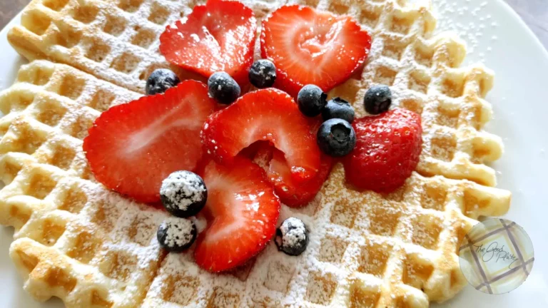 Buttermilk waffles with strawberry sauce and blueberries